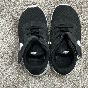 Black boys Size 10 Nike sneakers. Played in but still in great condition.